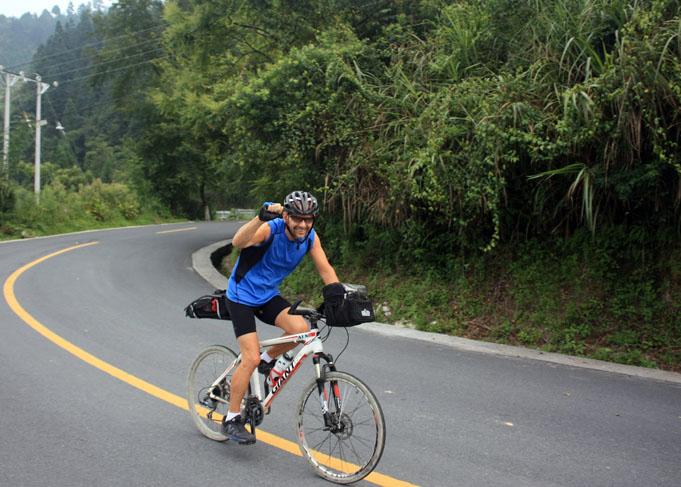 Cycling in Guizhou, we may need to overcome big mountains everyday.