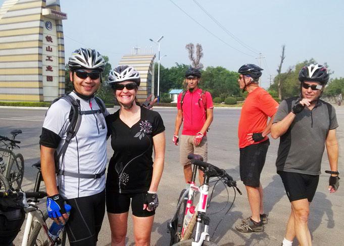 Our bike fixer and driver Mr. Bai cycled with guests, he is also a good leader for Chinese groups. 